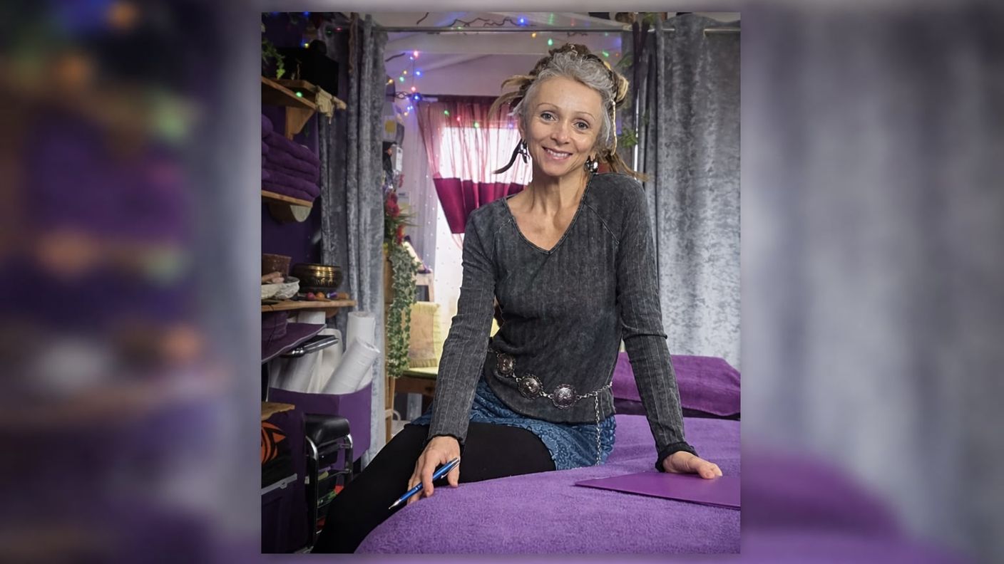 Shop owner Sandy on a massage bed